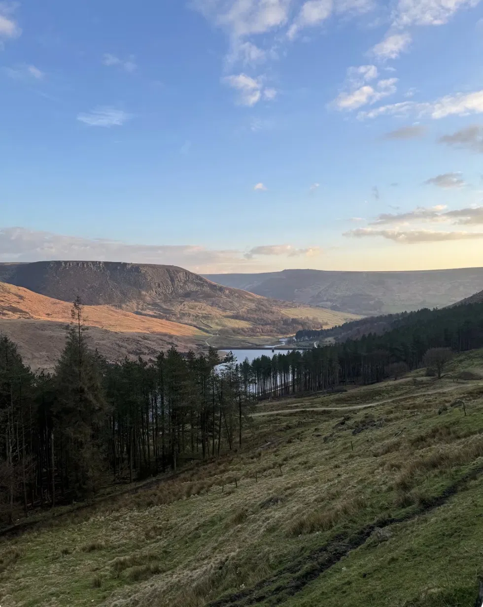 A view down the Holme Valley in West Yorkshire, looking over the reservoir toward the moorland beyond